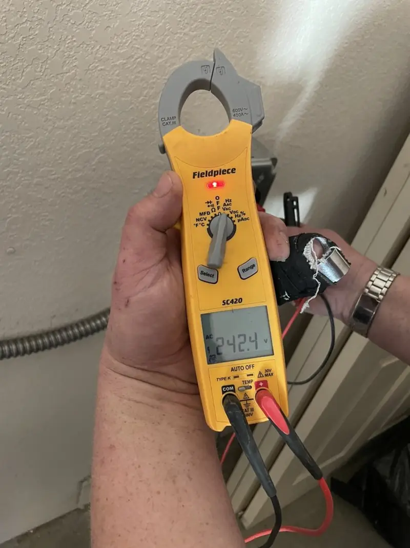 Voltage testing with clamp meter during Electrical Installation Services in Dublin